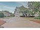 Elegant two-story home with a spacious driveway and well-maintained landscaping at 207 Tiverton Trl, Peachtree City, GA 30269