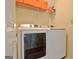 Well-equipped laundry room featuring modern appliances and plenty of storage space at 207 Tiverton Trl, Peachtree City, GA 30269