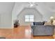 Large living room with vaulted ceilings, gray sofa and flat screen television at 207 Tiverton Trl, Peachtree City, GA 30269