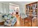 Comfortable living room with hardwood floors, fireplace, and built-in bookcase at 207 Tiverton Trl, Peachtree City, GA 30269