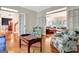 Open concept living room with hardwood floors and multiple access points at 207 Tiverton Trl, Peachtree City, GA 30269
