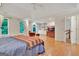 Large main bedroom with built-in shelving, cozy sitting area, and views of nature at 207 Tiverton Trl, Peachtree City, GA 30269