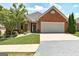 Charming brick home with well-manicured lawn, inviting entrance, and a two-car garage at 273 Prominent Loop, Mcdonough, GA 30253