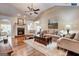 Inviting living room with a fireplace, hardwood floors, and comfortable seating arrangements at 273 Prominent Loop, Mcdonough, GA 30253
