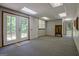 Basement featuring double doors leading outside to the yard and natural light at 4950 Creel Rd, Fairburn, GA 30213