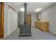 Basement features a wood burning stove, cabinets and pegboard walls at 4950 Creel Rd, Fairburn, GA 30213
