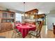 Dining area with traditional wooden furniture, flowing into the kitchen with wood cabinetry at 4950 Creel Rd, Fairburn, GA 30213