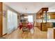 Dining room with hardwood floors, traditional furniture, and natural light from nearby windows at 4950 Creel Rd, Fairburn, GA 30213