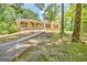 Inviting single-story home with a covered porch and landscaped front yard at 4950 Creel Rd, Fairburn, GA 30213