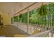 Expansive front porch with swing, rocking chairs, and beautiful views of the wooded surroundings at 4950 Creel Rd, Fairburn, GA 30213
