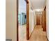 Inviting hallway with hardwood floors and warm paint, connecting various rooms in the home at 4950 Creel Rd, Fairburn, GA 30213
