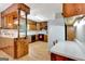 Classic kitchen featuring wooden cabinets, white countertops, and modern appliances at 4950 Creel Rd, Fairburn, GA 30213