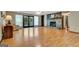 Bright living room with hardwood floors, stone fireplace, and view of the outdoors at 4950 Creel Rd, Fairburn, GA 30213