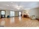 Large living room with hardwood floors, ample space, and a view into the dining area at 4950 Creel Rd, Fairburn, GA 30213