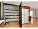 Walk-in pantry with lots of shelving next to the kitchen featuring wood cabinets and appliances at 4950 Creel Rd, Fairburn, GA 30213