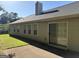 The backyard features a patio with vinyl siding and a grassy lawn at 3505 Saddle Creek Ln, Ellenwood, GA 30294