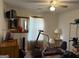 Bedroom featuring exercise equipment, a mirror, and a ceiling fan at 3505 Saddle Creek Ln, Ellenwood, GA 30294