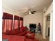 Comfortable living room with bright light and large red sectional sofa at 3505 Saddle Creek Ln, Ellenwood, GA 30294