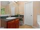 This serene bathroom includes a neutral palette and built-in vanity and mirror at 5865 El Segundo Way, Atlanta, GA 30349