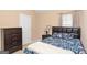 This delightful bedroom includes a decorative bed, dresser, and natural light at 5865 El Segundo Way, Atlanta, GA 30349