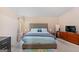 This expansive bedroom features generous natural light, decor, and neutral color palette at 5865 El Segundo Way, Atlanta, GA 30349