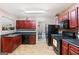 Functional kitchen with dark cabinetry and appliances, offering ample counter space at 5865 El Segundo Way, Atlanta, GA 30349