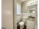 Well lit bathroom with tiled walls and granite vanity at 2896 Hogan Rd, East Point, GA 30344