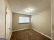 Comfortable bedroom with plush carpeting, a single window, and neutral-colored walls at 2896 Hogan Rd, East Point, GA 30344