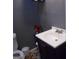 Close-up of a well-maintained half-bathroom with a modern vanity and stylish decor at 4032 Ward Lake Trl, Ellenwood, GA 30294