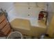 A close up of a white built in bathtub with tile surround, faucet, shower head and soap at 4032 Ward Lake Trl, Ellenwood, GA 30294