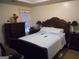 Comfortable bedroom with tray ceiling, neutral tones, and ample natural light at 4032 Ward Lake Trl, Ellenwood, GA 30294