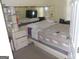 Contemporary bedroom with a platform bed and built-in mirrored shelving at 4032 Ward Lake Trl, Ellenwood, GA 30294