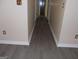 Hallway with gray wood floors and neutral walls at 4032 Ward Lake Trl, Ellenwood, GA 30294