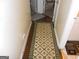 Hallway with wood flooring and a rug with a bee design at 4032 Ward Lake Trl, Ellenwood, GA 30294