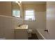 Bright bathroom with white tile, white vanity and updated fixtures at 2364 Farley St, East Point, GA 30344