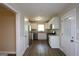 Modern kitchen featuring stainless steel appliances, white cabinets, and hardwood floors at 2364 Farley St, East Point, GA 30344