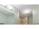 Well-lit bathroom featuring a tiled shower with decorative accents and modern fixtures at 2810 Promenade Pl, Buford, GA 30519