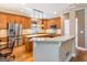 Modern kitchen with stainless steel appliances, custom cabinets, and center island with granite countertop at 2810 Promenade Pl, Buford, GA 30519