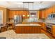Well-equipped kitchen with stainless steel appliances, granite countertops, and custom cabinetry at 2810 Promenade Pl, Buford, GA 30519