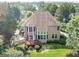 Lovely backyard featuring a small wood deck, and plentiful green landscaping at 2810 Promenade Pl, Buford, GA 30519