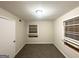 Bedroom with neutral walls, new carpeting, closet, and a window at 4390 Mercer Rd, Decatur, GA 30035