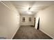 Spacious bedroom featuring neutral paint, plush carpet, and a ceiling fan at 4390 Mercer Rd, Decatur, GA 30035