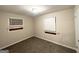 Bedroom with neutral walls, new carpeting, and two windows at 4390 Mercer Rd, Decatur, GA 30035