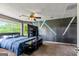 Bedroom with flat screen tv, ceiling fan, neutral walls and plush carpet at 68 Riveree Rd, Brooks, GA 30205