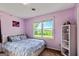 Bedroom with two windows, a closet and an open shelving unit at 68 Riveree Rd, Brooks, GA 30205