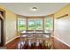 Dining room shows hardwood floors, bay windows and chair-rail at 68 Riveree Rd, Brooks, GA 30205
