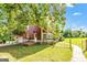 Exterior of a charming two-story home with a wooden deck and lush green lawn at 68 Riveree Rd, Brooks, GA 30205
