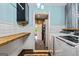 Laundry room with modern appliances, unique flooring and trim at 68 Riveree Rd, Brooks, GA 30205