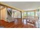Living room view features hardwood floors, access to front door and stairs to 2nd floor, and eat-in nook at 68 Riveree Rd, Brooks, GA 30205
