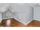 Bright bedroom features hardwood floors, light blue walls and an octagon window for plenty of natural light at 441 Crumbley Rd, Mcdonough, GA 30252